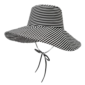 Wide brim sun hat with black and white stripes and ribbon ties for outdoor protection