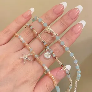 Perlenarmband-Set mit Seestern-, Muschel- und Delfinanhängern für den Strandurlaub am Meer
