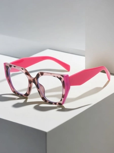 Detail of pink cat-eye glasses frame with leopard pattern and neon pink temples
