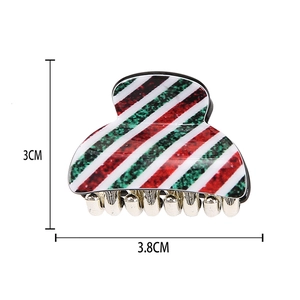 Detail view of mini Christmas acrylic hair clip with festive stripes, size 3.8cm by 3cm
