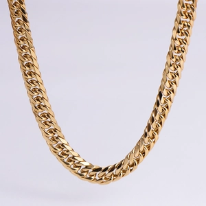 Close-up of a high-polished 18k gold plated stainless steel heavy Cuban link chain necklace