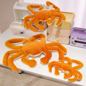 Three sizes of orange plush king crab toys used as home pillows and decorative dolls