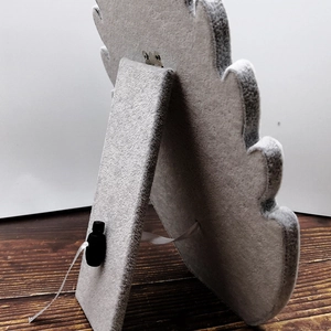 Rear view of grey velvet necklace display stand featuring a foldable L-shaped support leg