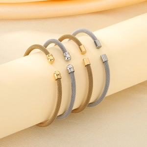 Detail of 4mm mesh woven cable open bracelets in 18K gold and silver plating
