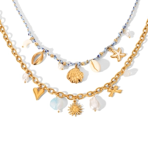 Golden ocean theme necklaces with blue rope, starfish, shell charms and pearls on white background