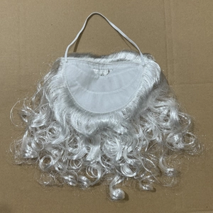 Close-up of curly white Santa Claus beard with elastic strap on a flat surface