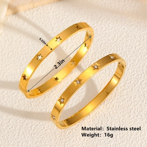 Gold star stainless steel bangle set with hollow design and rhinestone accents