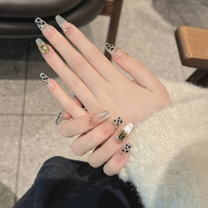 Luxurious leopard print press-on nails with cat-eye effect and gold glitter decoration