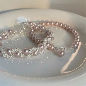 Elegant pearl and crystal flower bracelet set in champagne pink with silver clasp