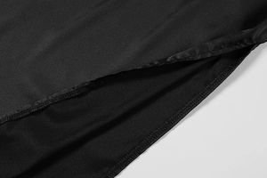 Detail view of the sleek side slit and precision stitching on this black summer dress