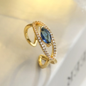 Gold plated open ring with blue marquise gemstone and cubic zirconia accents
