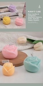 Close-up of rose shaped scented candles in pastel colors on a soft knitted background