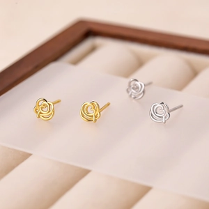 Exquisite S999 sterling silver hollow rose flower stud earrings in gold and silver finish