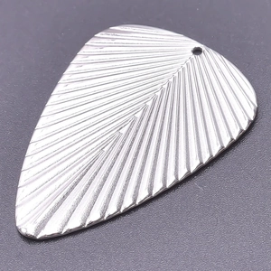 Detailed macro view of a silver stainless steel leaf pendant with delicate vein textures