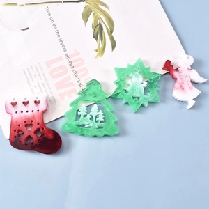Christmas themed resin pendants including Santa, elk, and trees for DIY holiday jewelry crafts