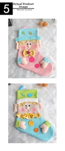Detail of elf-themed Christmas stockings with colorful knit patterns and plush trim