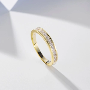 Classic gold S925 silver ring featuring colorful channel-set pavé crystals on a geometric background