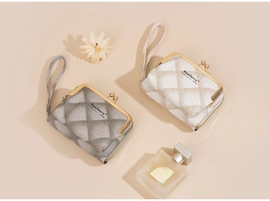 Detailed view of quilted faux leather coin purses with elegant metal kiss lock closure