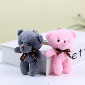 Detail of grey and pink plush teddy bear pendants with Love ribbon and metal chains