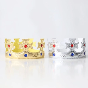 Detail view of gold and silver fabric king crowns with colorful faux gemstones for birthday