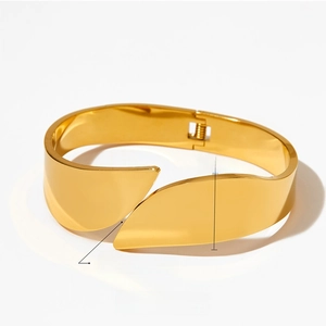 Polished gold stainless steel wide cuff bracelet showing 18mm width and adjustable open design