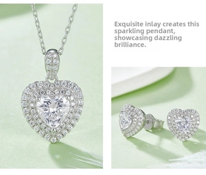 Detail of silver heart necklace and matching earrings set with sparkling pavé crystals