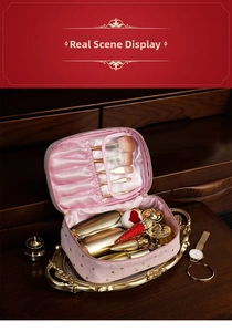 Detail of pink velvet makeup bag showing interior makeup brush slots and star pattern