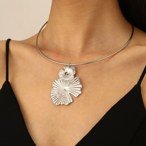 Close-up of silver metal choker featuring a double-layered textured fan leaf pendant
