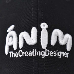 Classic washed cotton baseball cap in black with white 'anim' letter embroidery