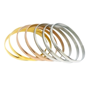 Set of seven minimalist gold, rose gold and silver polished stainless steel stackable bangles