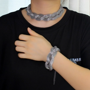Silver woven mesh titanium steel necklace and bracelet set worn by a fashion model