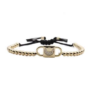 Adjustable black rope bracelet with gold beads and sparkling zircon crescent moon charm