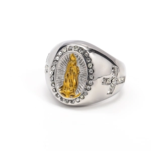 Macro shot of silver titanium steel ring with Our Lady of Guadalupe gold relief and zircon