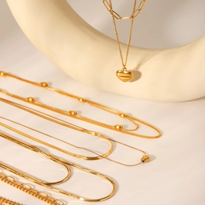Layered 18K gold plated stainless steel necklaces featuring elegant heart pendants