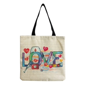 Detail of canvas nurse tote bag featuring colorful LOVE typography and medical icons