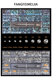 Macro detail of 21-grid nail art crystal set with multi-size glass rhinestones and tools