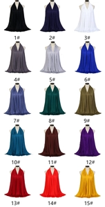 Matrix display of 15 solid colors jersey cotton scarves on white mannequin busts