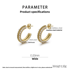 Detail of gold C-shaped stainless steel earrings with shell pearls, width 23mm