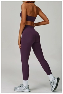 Detail of dark purple high waist yoga leggings with scrunch butt seam and sports bra