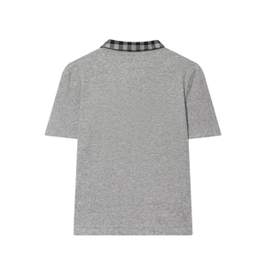 Back view of grey short-sleeve polo shirt with black and white plaid collar detail