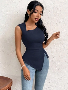 Macro detail of navy blue slim fit sleeveless top with asymmetrical hem and textured fabric