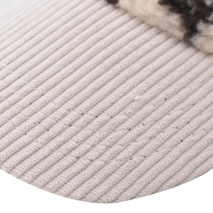Detailed macro view of corduroy fabric texture and fluffy leopard print faux fur