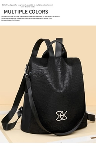 Detail of black multi-functional backpack featuring glitter texture and silver logo