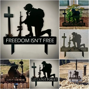 Detail showing memorial soldier metal stake with Freedom Isn't Free text in various gardens