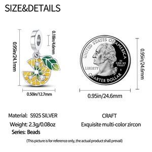 Macro view of S925 silver lemon charm with yellow enamel and measurements against a coin