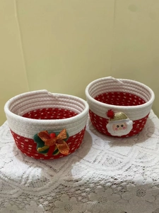 Detail of Christmas woven baskets with Santa patch and festive gift box decoration