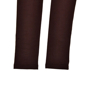 Detail shot of deep brown leggings showing reinforced double-needle stitching on the cuffs