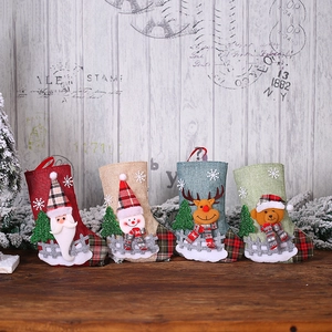 Set of 4 rustic burlap Christmas stockings featuring Santa, snowman, elk, and bear characters