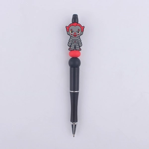 Detail of beaded ballpoint pen featuring creative clown character and colorful silicone beads