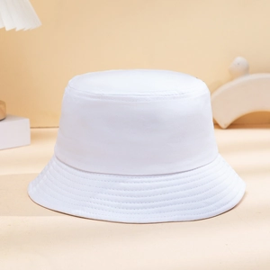 Detailed view of white cotton bucket hat featuring multi-row stitched brim and twill texture